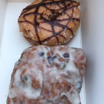 Dutch Monkey Doughnuts - Coffee buttercream Bismarck, lemon blueberry ginger fritter. Both AMAZING - Donuts Near Me - Cumming, Georgia