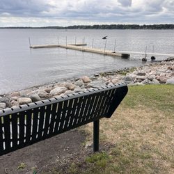 Wildcat Cove Playground - Bench in park with dock near playground