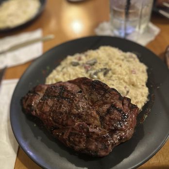 Prime Grill 1302 - This was the 12 ounce ribeye and the mushroom risotto. - Steakhouses Near Me - San Juan, Puerto Rico
