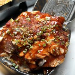 Lil Moe's Potatoes - Trio potato brisket, chicken and sausage .