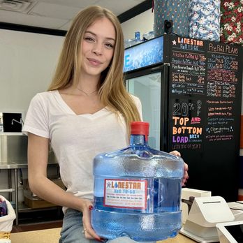 Lone Star H2O To-Go - a woman holding a bottle of water - Water Stores Near Me - Frisco, Texas Lone Star H2O To-Go - a woman holding a bottle of water - Water Stores Near Me - Frisco, Texas