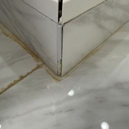 Incorrect shower glass placement caused shower dam to fail, per my contractor.