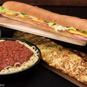 Peoria LaGondola Spaghetti House + Leonardo's - a large sub sandwich and a side of garlic bread - Italian Near Me - Peoria, Illinois Peoria LaGondola Spaghetti House + Leonardo's - a large sub sandwich and a side of garlic bread - Italian Near Me - Peoria, Illinois