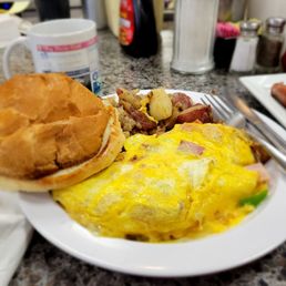 Western omelet,  grilled bulkie roll and home fries