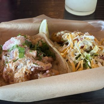 Torchy's Tacos - On the left is a Baja Shrimp taco. On the right is a Fried Avocado taco. Both equally delicious. - Tacos Near Me - Kyle, Texas