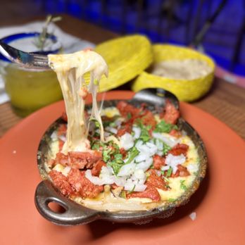 Ruta Oaxaca Mexican Cuisine - a pizza being lifted by a fork - Mexican Near Me - Patchogue, New York Ruta Oaxaca Mexican Cuisine - a pizza being lifted by a fork - Mexican Near Me - Patchogue, New York