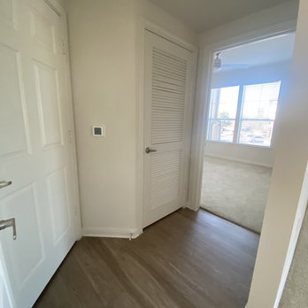 Camden Cedar Hills Apartments - Little hallway to second bathroom, closet, ac unit, and second bedroom - Apartments Near Me - Austin, Texas