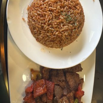 Cafe Nubia - Suya plate with jollof rice - Lounges Near Me - Dallas, Texas Cafe Nubia - Suya plate with jollof rice - Lounges Near Me - Dallas, Texas