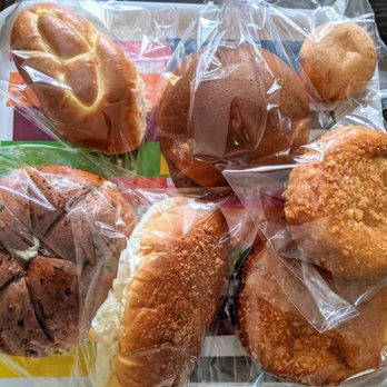 Lulu & Dino - Top: cream bun, Nutella bun, potato donut. Bottom: garlic cream cheese bun, peanut bun and two pork croquettes - Coffee & Tea Near Me - Bayside, New York Lulu & Dino - Top: cream bun, Nutella bun, potato donut. Bottom: garlic cream cheese bun, peanut bun and two pork croquettes - Coffee & Tea Near Me - Bayside, New York