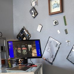Coast Computer - Work station with different computer parts, on the wall,  that are in you PC