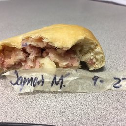 I found this piece of tape inside the kolache after taking a bite. Some of the ink bled into the ham. Pretty gross. I found this piece of tape inside the kolache after taking a bite. Some of the ink bled into the ham. Pretty gross.