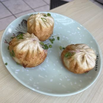 Wang's Shanghai Cuisine - 3/5 pan fried pork bun, because we couldn't wait for a photo before digging in - Noodles Near Me - Vancouver, British Columbia Wang's Shanghai Cuisine - 3/5 pan fried pork bun, because we couldn't wait for a photo before digging in - Noodles Near Me - Vancouver, British Columbia