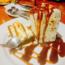Chili's - High & Mighty Pie: Heath candy pieces in rich vanilla ice cream piled high on a crushed Oreo cookie crust & drizzled w/ caramel & hot fudge.