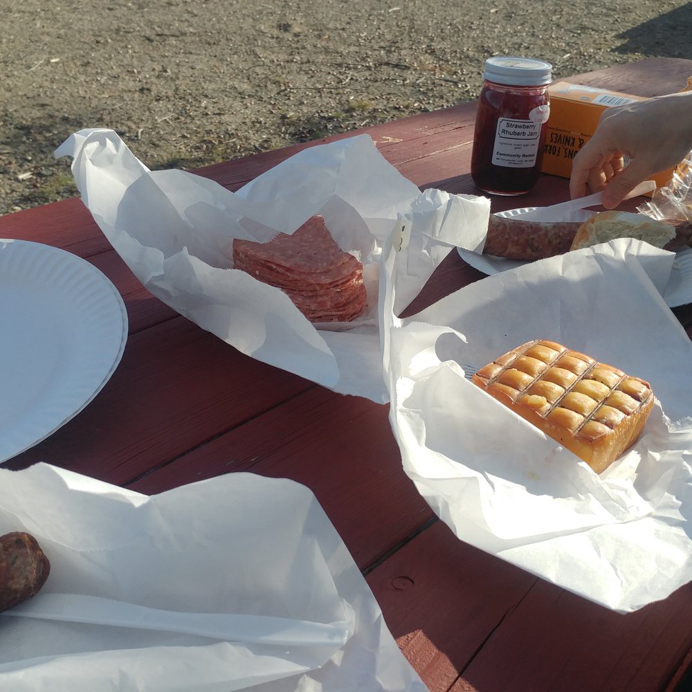 Charcuterie - a picnic table with plates of food - Butcher Near Me - Unity, Maine Charcuterie - a picnic table with plates of food - Butcher Near Me - Unity, Maine