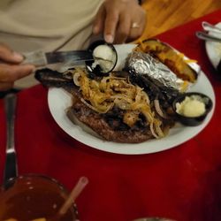 Edward's Steakhouse - Bone-in Ribeye steak with loaded baked potato