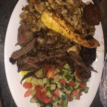 Eli's Jerusalem Grill - The combination plate of falafel, shawarma, and chicken with half couscous and rice. - Falafel Near Me - Birmingham, Alabama