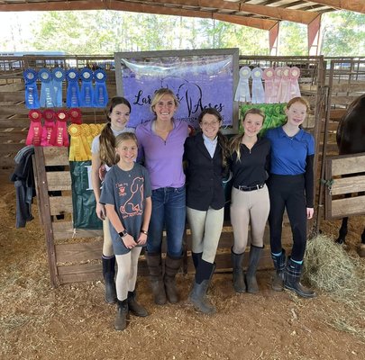 Creating Champions with Group Lessons. - Welcome to Larkspur Acres, where we offer exceptional group horseback hunter jumper lessons designed for riders of all skill levels, from beginners to advanced competitors. Under the expert guidance of Sydney, a collegiate champion with over 20 years of riding experience, our students consistently achieve winning results. Our group lessons provide a dynamic and collaborative environment where riders can learn and grow together, benefiting from both personalized instruction and peer support. At Larkspur Acres, we emphasize not only riding excellence but also the importance of horse care and education. Riders learn about proper grooming, feeding, and overall horse management, ensuring a well-rounded equestrian experience. With our state-of-the-art facilities and Sydney's proven track record, we create a supportive and professional atmosphere where every rider can thrive, build skills, and form lasting friendships. Join us at Larkspur Acres for group lessons and experience the joy of riding in a community of passionate equestrians.