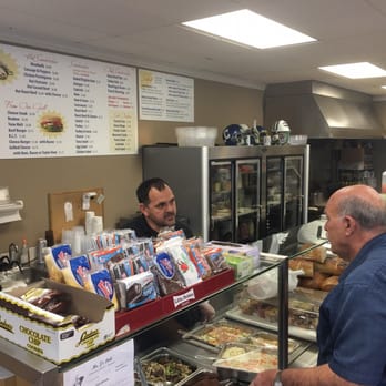 Mr. J's Deli - Owner and customer over the hot food bar. - Delis Near Me - Cranford, New Jersey Mr. J's Deli - Owner and customer over the hot food bar. - Delis Near Me - Cranford, New Jersey