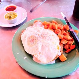 Breakfast chicken fried steak with eggs and papitas. Breakfast chicken fried steak with eggs and papitas.