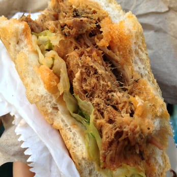 Pas D'cochon Dans Mon Salon - a hand holding a sandwich - Food Trucks Near Me Pas D'cochon Dans Mon Salon - a hand holding a sandwich - Food Trucks Near Me