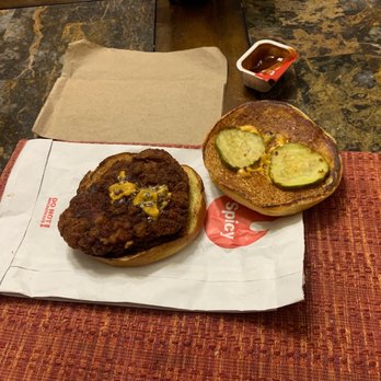 McDonald's - a burger and a pickle on a napkin - Burgers Near Me - Johnstown, Colorado