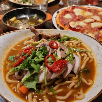 The Bench - Pork chop, pepperoni flatbread, and scallops in the back - New American Near Me - Pebble Beach, California The Bench - Pork chop, pepperoni flatbread, and scallops in the back - New American Near Me - Pebble Beach, California