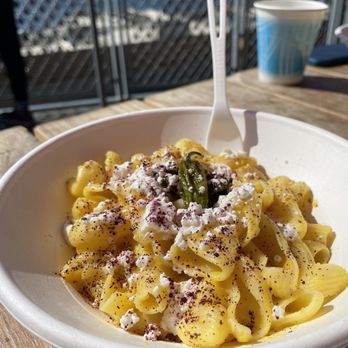 Pasta Casalinga - From the garden - Trottole with yellow pepper sugo, feta cheese, fried padron peppers and sumac - Italian Near Me - Seattle, Washington