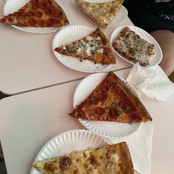 Leonardi’s Pizza - Slices from top left to right: Pepperoni, White, Burrata, Grandma (square), Fire on the Mountain, and another white. All super delicious! - Pizza Near Me - North Palm Beach, Florida Leonardi’s Pizza - Slices from top left to right: Pepperoni, White, Burrata, Grandma (square), Fire on the Mountain, and another white. All super delicious! - Pizza Near Me - North Palm Beach, Florida