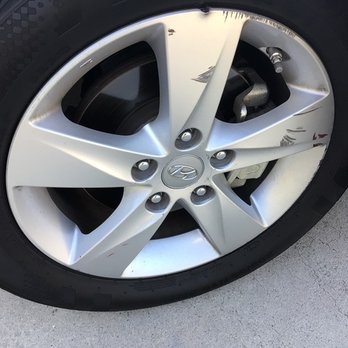 AJ Wheel Repair- - Before (note the missing chunk of metal at top of rim.) - Wheel & Rim Repair Near Me - San Diego, California