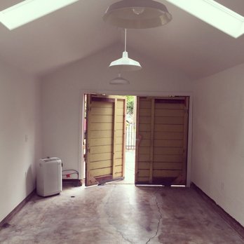 East Sac General Contracting - Victor took the original door, cut it in half, and created pivoting hinges for a cool, rustic effect. - General Contractors Near Me