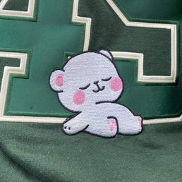 Sleeping bear leaning on a large "49" number