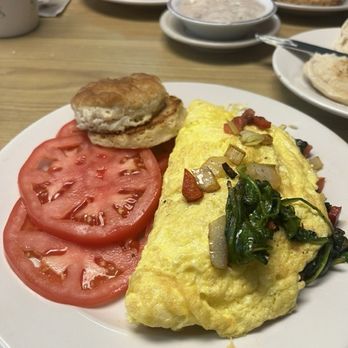 My Nanny's Restaurant - Spectacular Mediterranean omelette with sliced tomatoes and a toasted biscuit! - American Near Me - Spring Hill, Florida