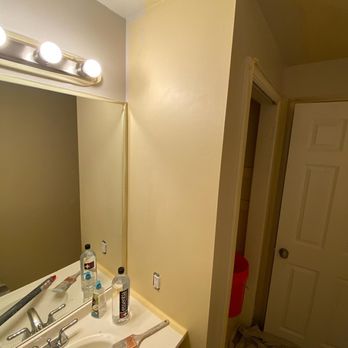 Supreme Painting - Before of a clients bathroom. Changing yellow to grey. - Painters Near Me