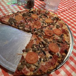 18" sausage, bacon, tomato, mushroom, and garlic pizza.