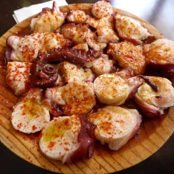 Celta - Pulpo a la plancha (grilled octopus) with olive oil and paprika spice - Tapas Bars Near Me - Barcelona, B Celta - Pulpo a la plancha (grilled octopus) with olive oil and paprika spice - Tapas Bars Near Me - Barcelona, B