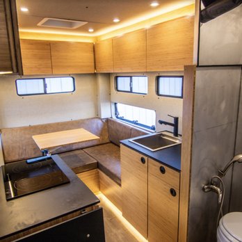 Rossmönster - Interior of a Baja truck camper built by Rossmönster. This truck camper houses an interior wet bath, kitchenette, and two sleeping areas. - Auto Customization Near Me - Longmont, Colorado Rossmönster - Interior of a Baja truck camper built by Rossmönster. This truck camper houses an interior wet bath, kitchenette, and two sleeping areas. - Auto Customization Near Me - Longmont, Colorado