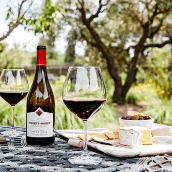 Truett Hurst - two glasses of wine and cheese on a table - Wine Tasting Room Near Me - Healdsburg, California Truett Hurst - two glasses of wine and cheese on a table - Wine Tasting Room Near Me - Healdsburg, California