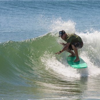 Summertime Surf - Belmar - Instructor Stirling having fun in the great conditions in between lessons! - Paddleboarding Near Me - Belmar, New Jersey