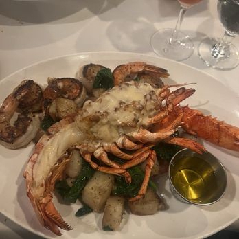 The Wharf - Seafood Sampler: Stuffed half lobster with crab imperial, butter cream sauce, scallops, shrimp, roasted potatoes and spinach - Seafood Near Me - Alexandria, Virginia The Wharf - Seafood Sampler: Stuffed half lobster with crab imperial, butter cream sauce, scallops, shrimp, roasted potatoes and spinach - Seafood Near Me - Alexandria, Virginia