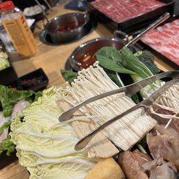 My single combo before cooking- some sort wagyu, tendon, tilapia, various veggies My single combo before cooking- some sort wagyu, tendon, tilapia, various veggies