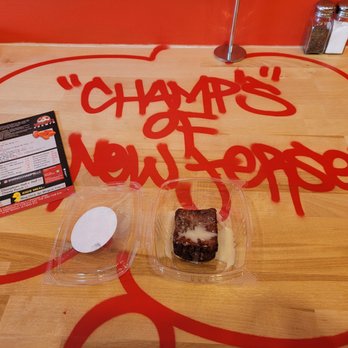 Wing Champs - a piece of cake in a plastic container - Desserts Near Me - Bloomfield, New Jersey