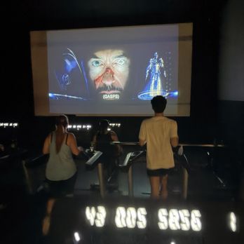 EōS Fitness - Ironman playing in the cardio theater - Gyms Near Me - Henderson, Nevada EōS Fitness - Ironman playing in the cardio theater - Gyms Near Me - Henderson, Nevada