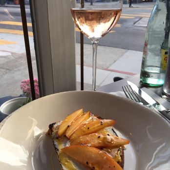 Bodega - Ricotta toast with saffron honey and peaches + Rose - Wine Bars Near Me - San Francisco, California Bodega - Ricotta toast with saffron honey and peaches + Rose - Wine Bars Near Me - San Francisco, California