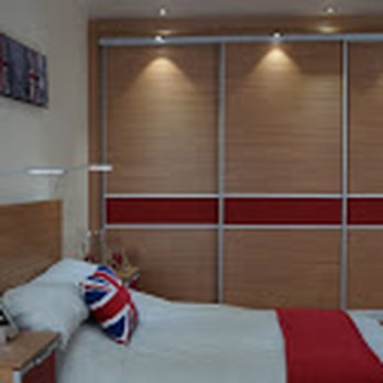 Monarch Bedrooms - Beautiful Natural Urbano and Frosted Red Glass Sliding Wardrobe Doors - Furniture Stores Near Me - Macclesfield, CHE