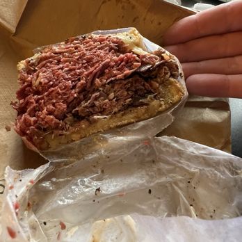 Slyman's Restaurant - Half of a half pastrami, half corned beef Reuben - American Near Me - Cleveland, Ohio Slyman's Restaurant - Half of a half pastrami, half corned beef Reuben - American Near Me - Cleveland, Ohio