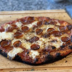ooni - No leftovers lol Best pizza i've ever had no joke!! I highly recommend making this investment!! Finished roman style thin pepperoni pizza :D
