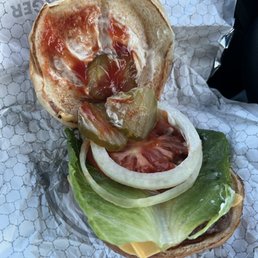 Plain burger with just ketchup and pickles. Missing fries and drink amongst order. Plain burger with just ketchup and pickles. Missing fries and drink amongst order.