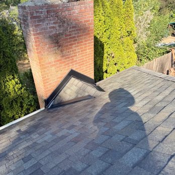 Shark's Roofing - If you need a cricket on your chimney we got it as well - Roofing Near Me
