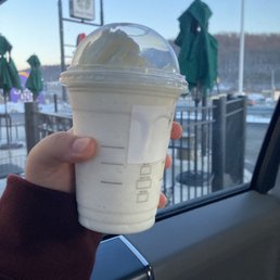 a hand holding a cup of coffee a hand holding a cup of coffee