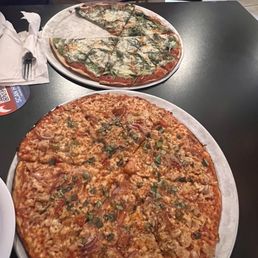 Original pizza with spinach, topping,  And - clam pizza, with hot cherry peppers,red onions..